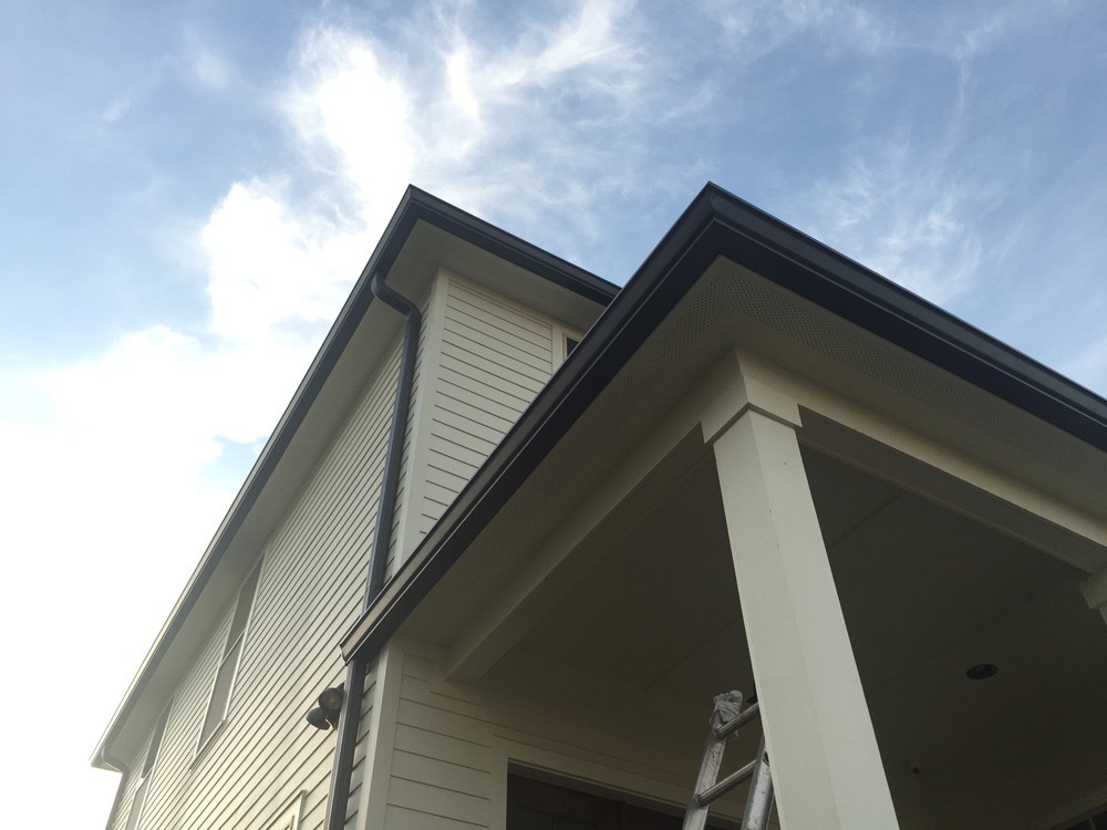 Brown Gutters on two story New Orleans home - Strong Shield