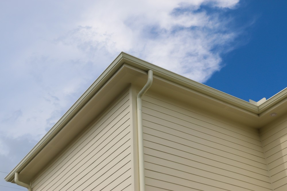 Tan round gutters in New Orleans - Strong Shield