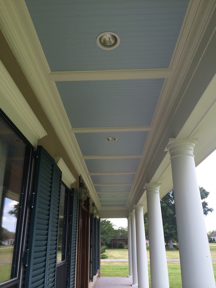 Blue bead board porch ceiling with white trim and columns in Metairie - Strong Shield