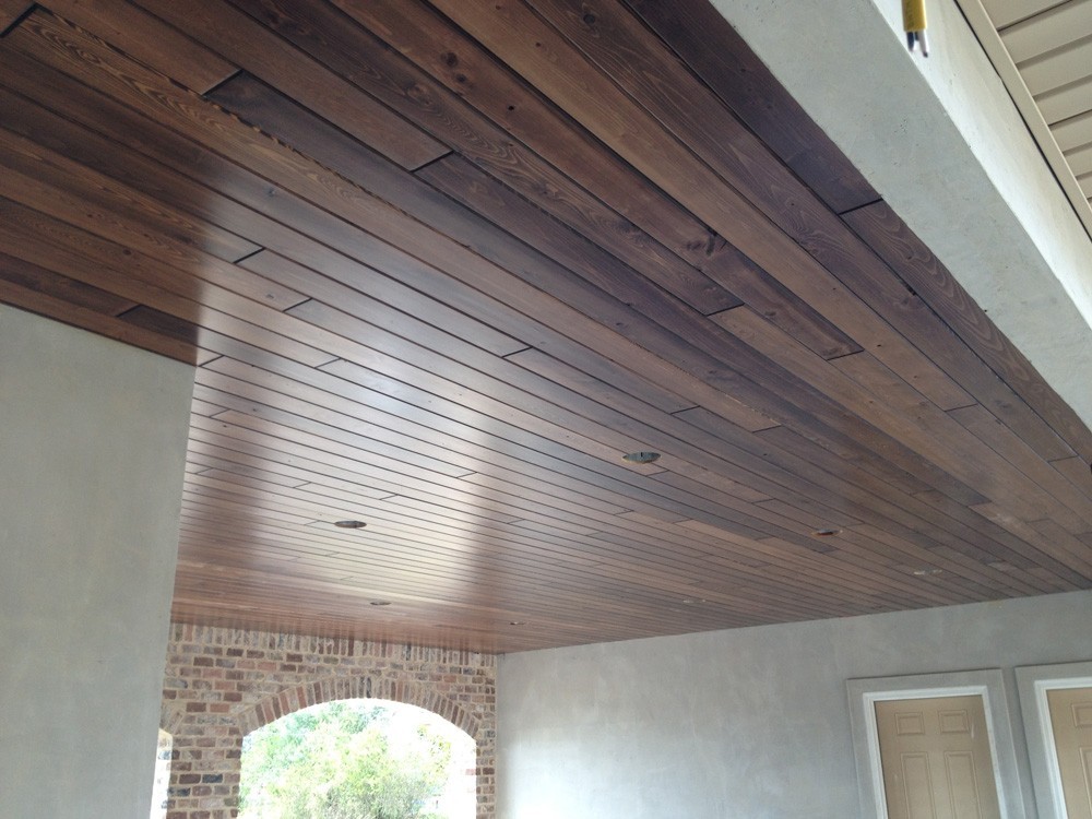 Wood porch ceiling with brick and stucco home - Strong Shield