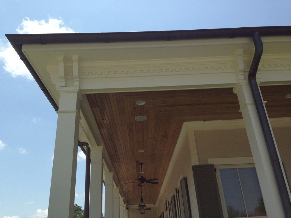Wrap around porch with wood ceiling and dentil molding- Strong Shield