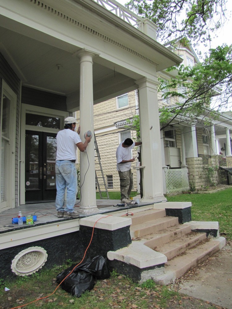 Sanding and repainting porch columns in New Orleans - Strong Shield