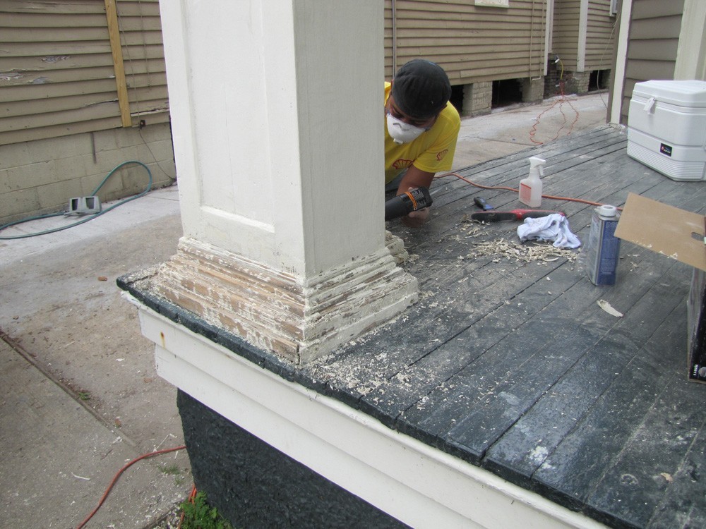 Sand and repaint porch columns and trim - Strong Shield