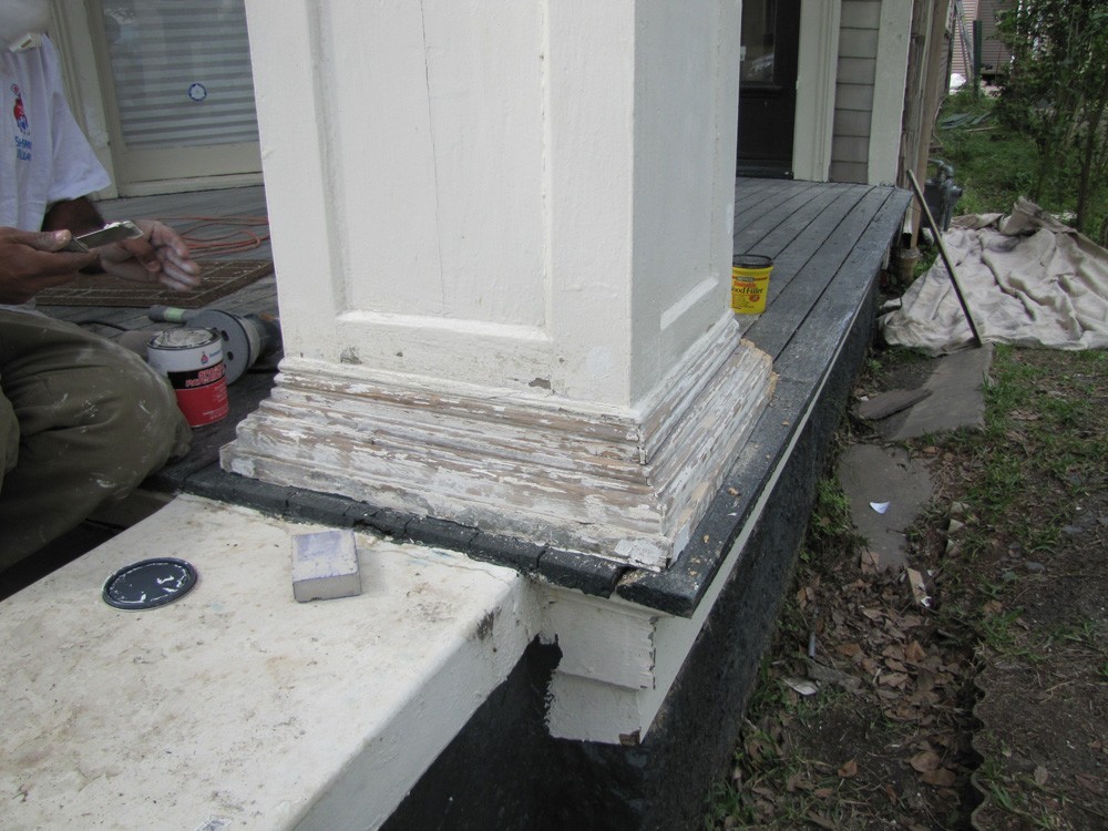 Repainting trim at base of columns - Strong Shield