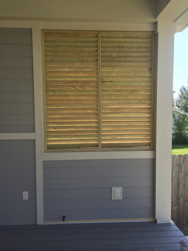 Wood shutters on porch - Strong Shield