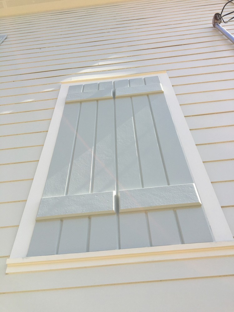 Custom wood shutters on New Orleans home - Strong Shield