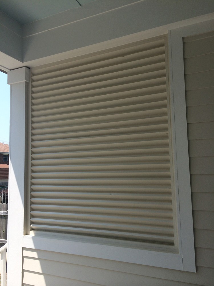 Shutters for covered patio in New Orleans - Strong Shield