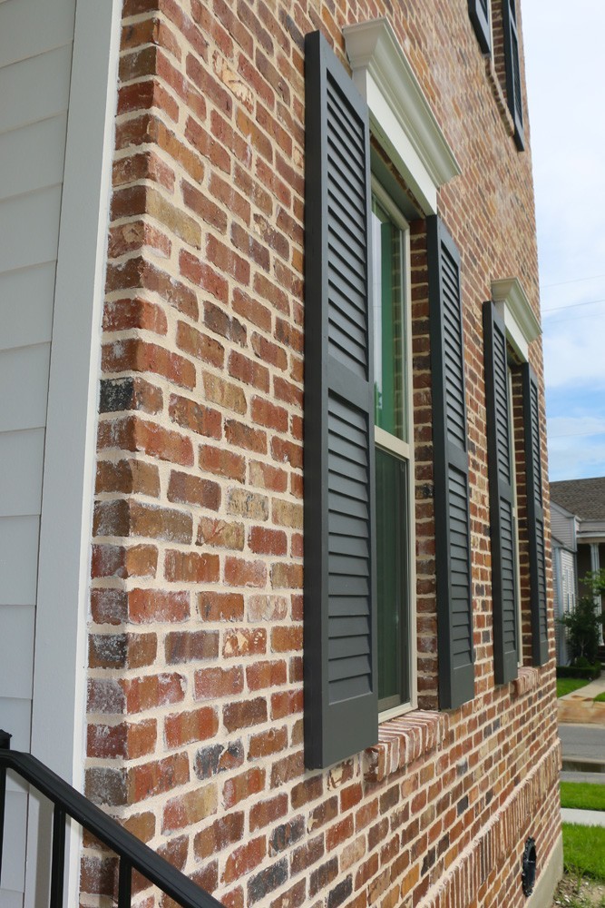 Shutters for red brick with white window trim - Strong Shield