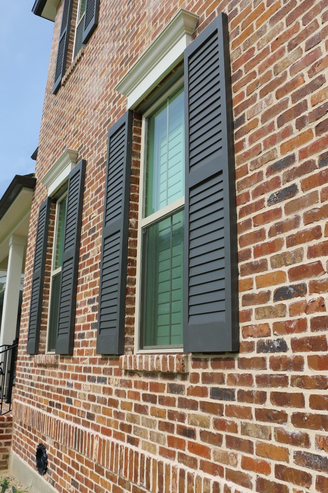 New Orleans home with wood shutters - Strong Shield
