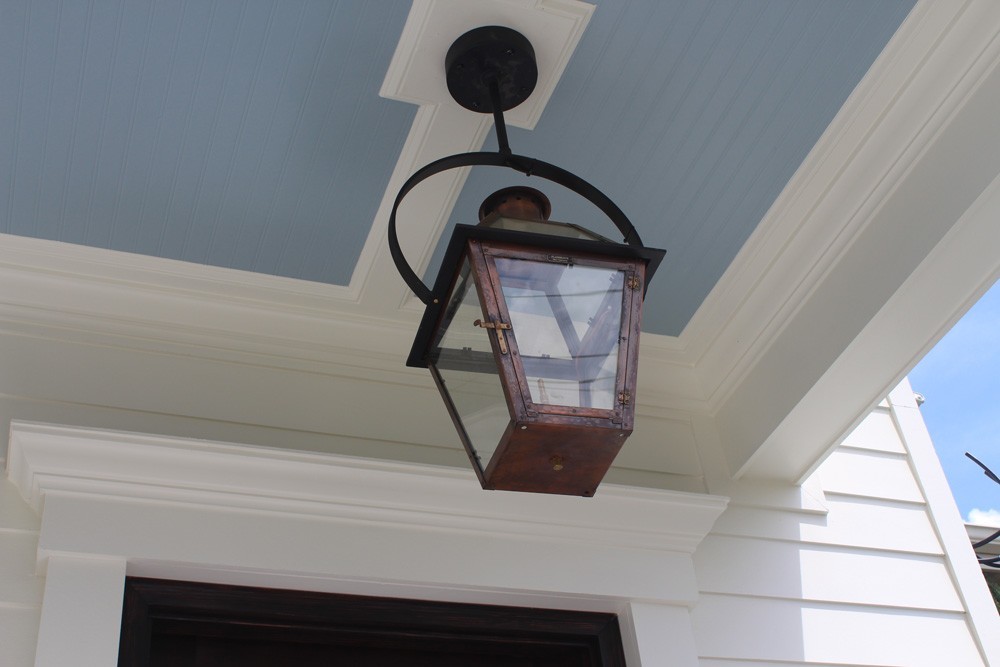 Copper gas lantern mounted on craftsman style trim - Strong Shield