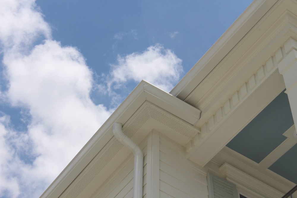 Dentil molding and round gutters on New Orleans home - Strong Shield