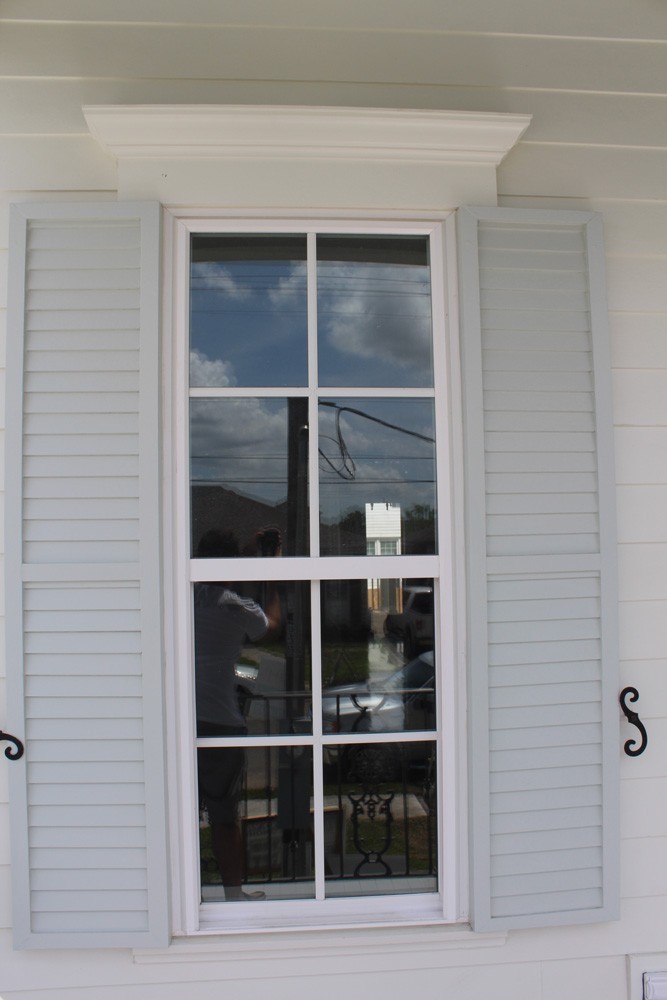 Craftsman style window trim and louvered panel shutters - Strong Shield