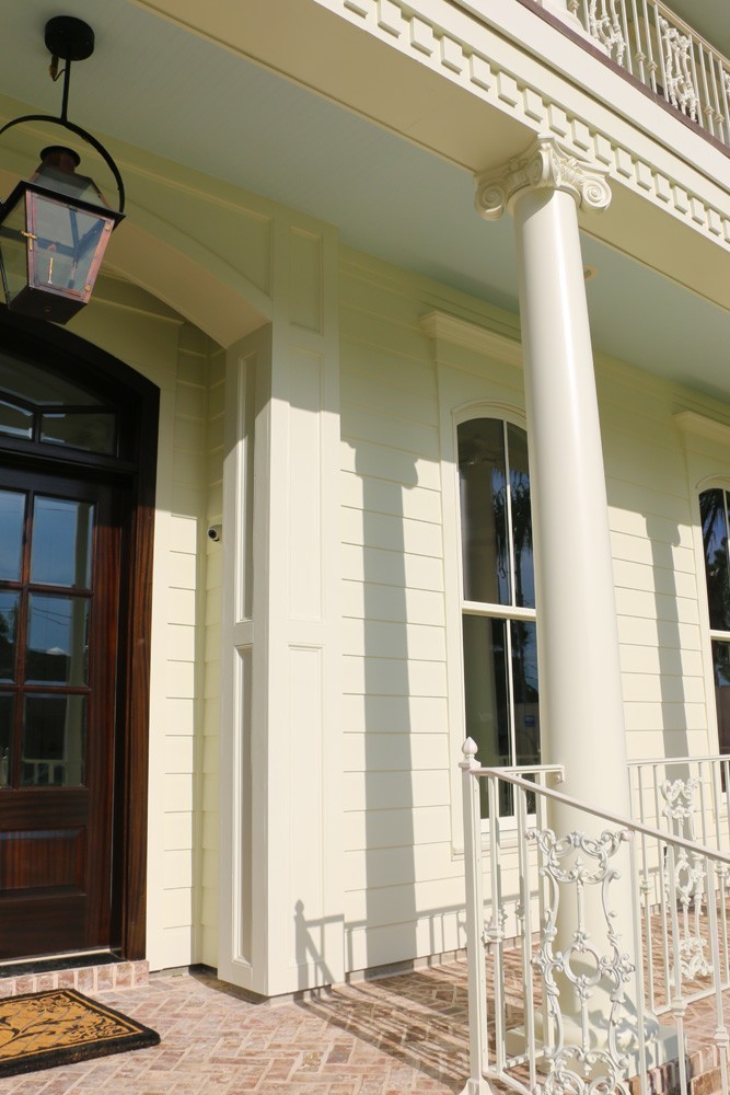 White iron railing, round tapered columns with grecian molding - Strong Shield