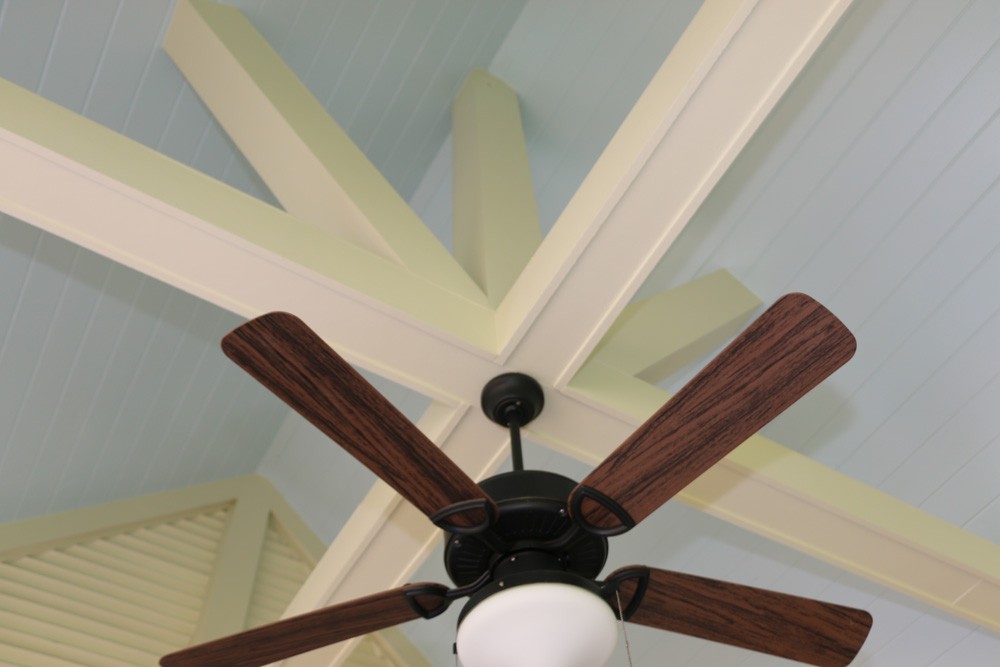Ceiling fan mounted on cathedral porch ceiling beams - Strong Shield
