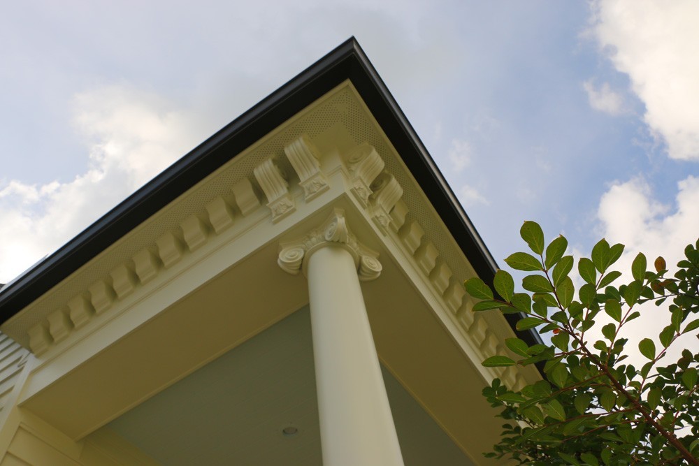Intricate crowning trim pieces below porch soffits - Strong Shield