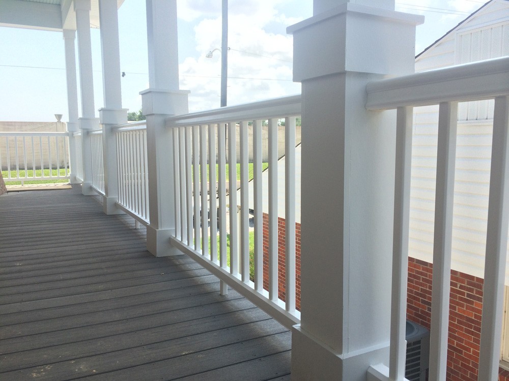 Craftsman columns and railing on New Orleans home balcony - Strong Shield