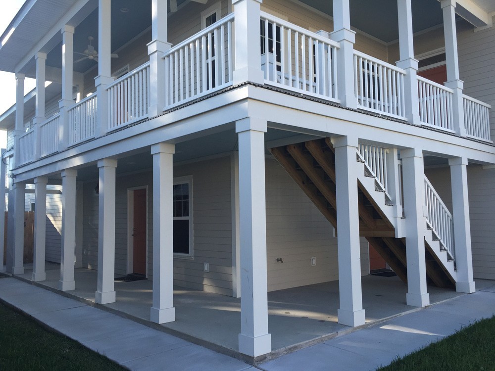 Columns and railing on two story New Orleans home - Strong Shield