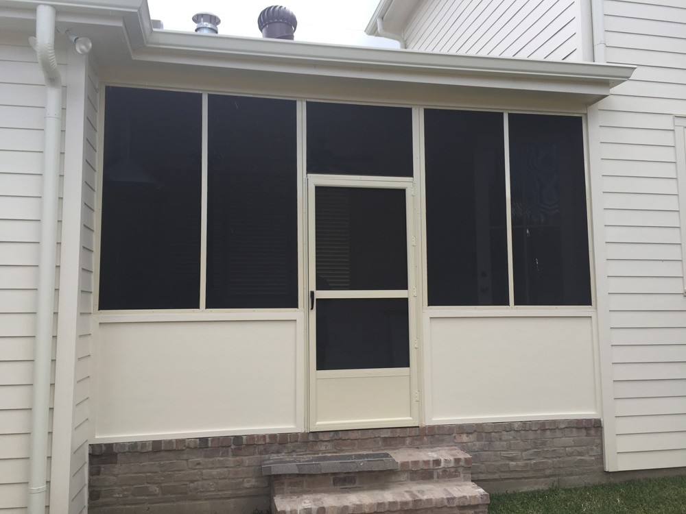 Screened patio enclosure with door in New Orleans - Strong Shield