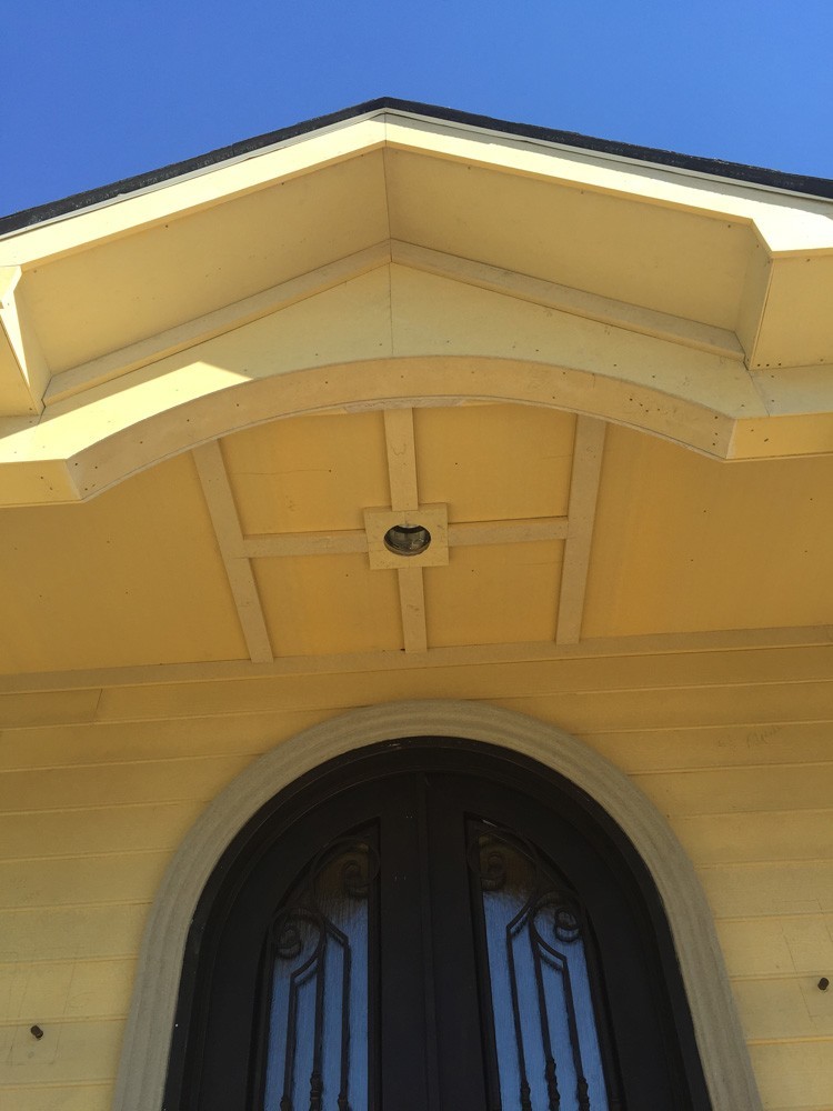 Porch ceiling above arched door in New Orleans - Strong Shield