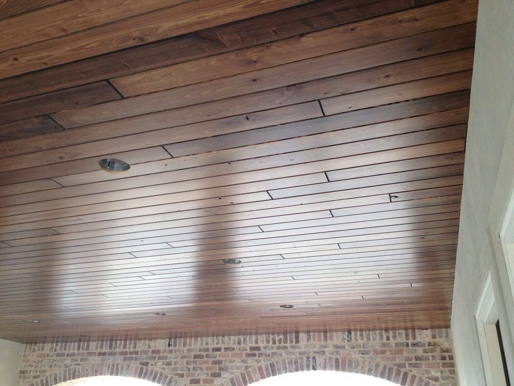 Metairie home with wood porch ceiling - Strong Shield