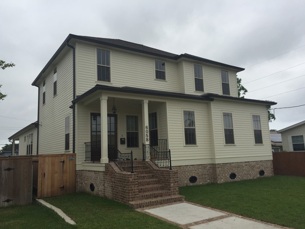 Brown Gutters on New Orleans two story home - Strong Shield