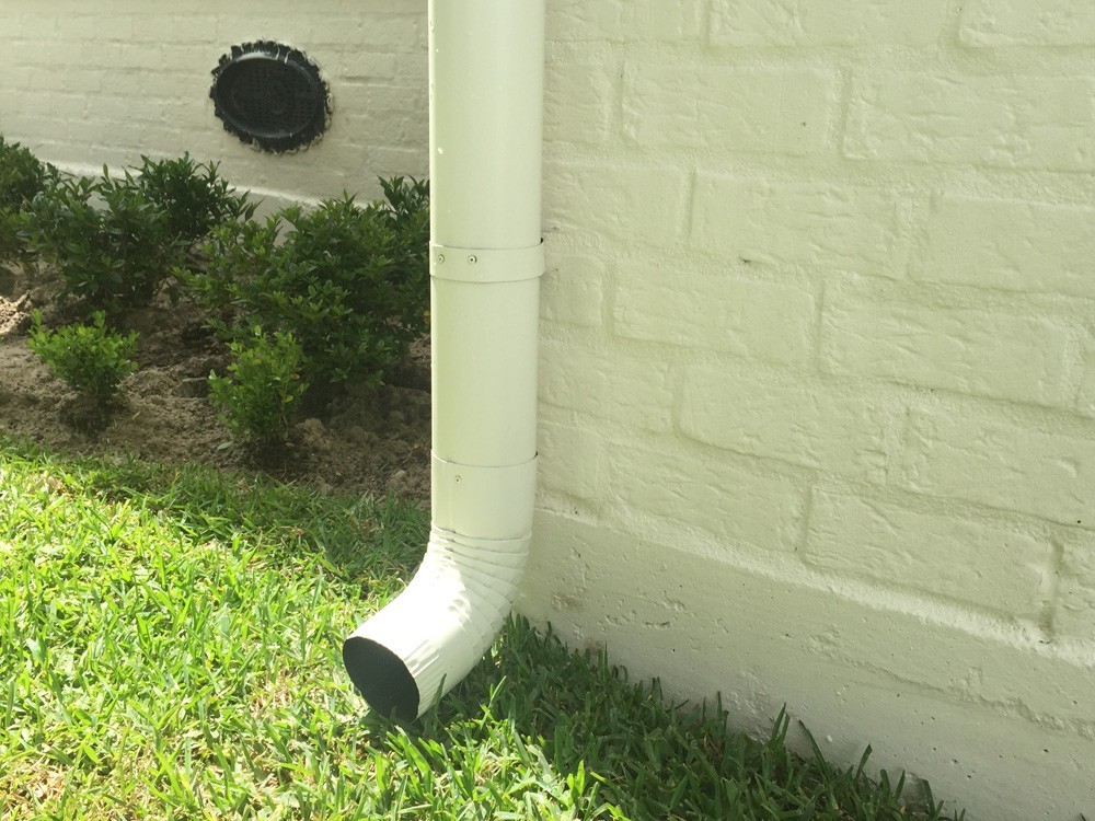Gutter downspout on brick - Strong Shield