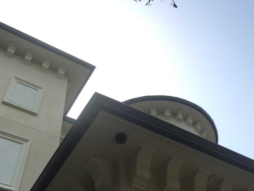 Gutters on unique roofline in New Orleans - Strong Shield