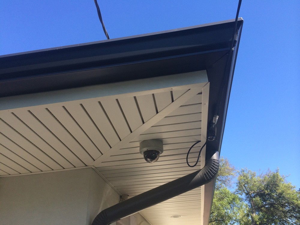 Gutter downspout near security camera in New Orleans - Strong Shield