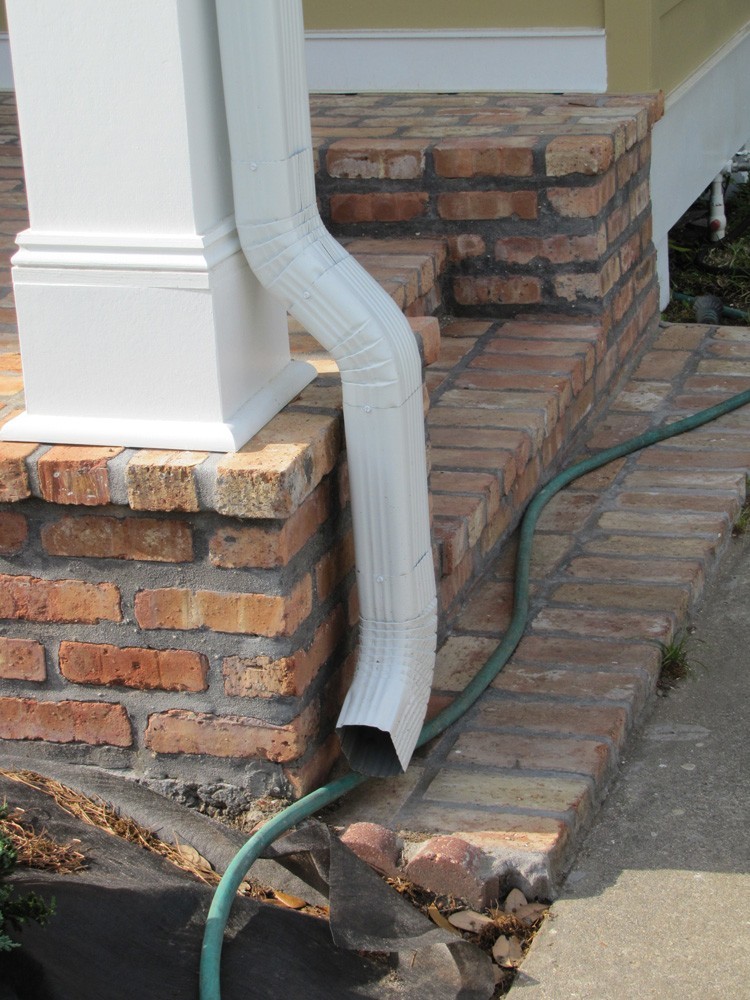 Gutter downspout near steps in New Orleans - Strong Shield