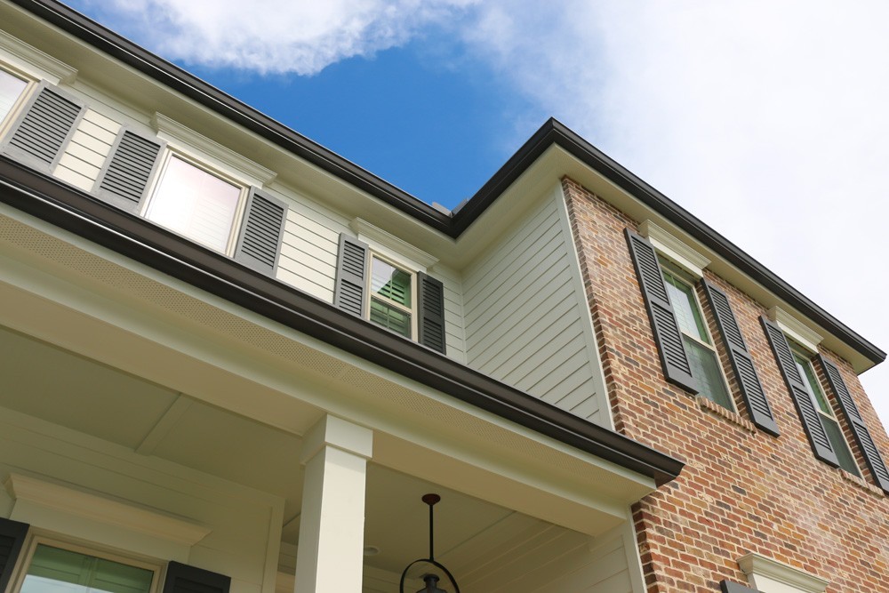 Brown Gutters on traditional house in New Orleans - Strong Shield