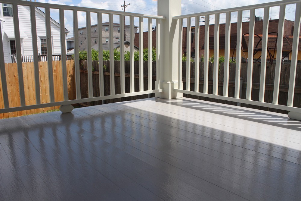 Balcony with wooden banister in New Orleans - Strong Shield