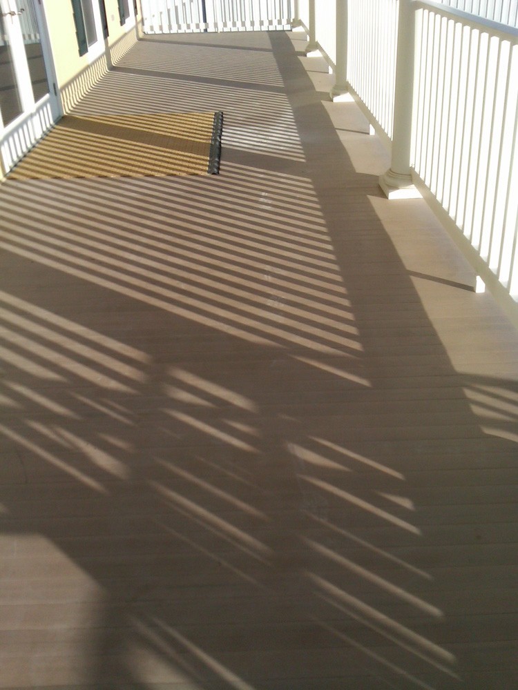 Brown painted porch in New Orleans - Strong Shield