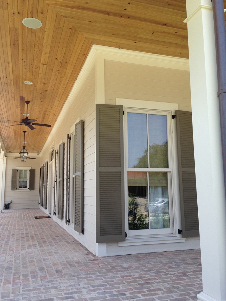 Light wood porch ceiling on hardie house - Strong Shield