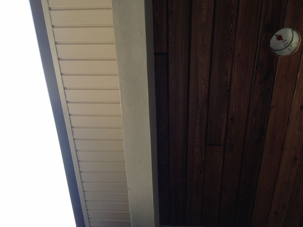 Porch with rich wood ceiling - Strong Shield