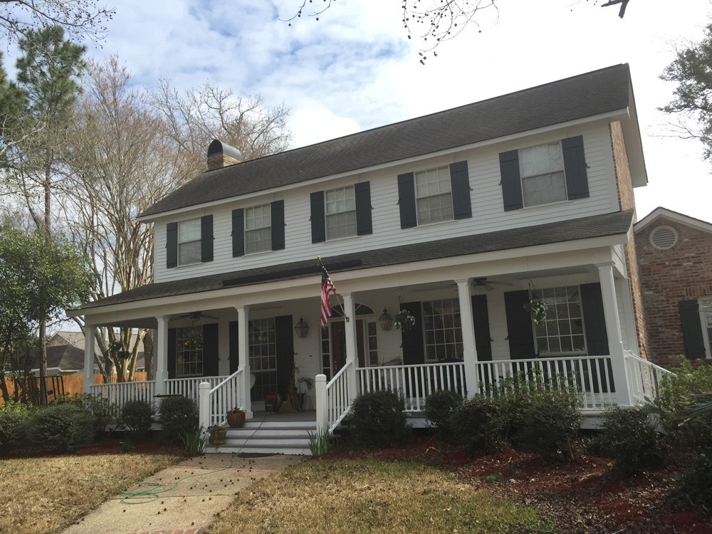 Black shutters on two story white home - Strong Shield