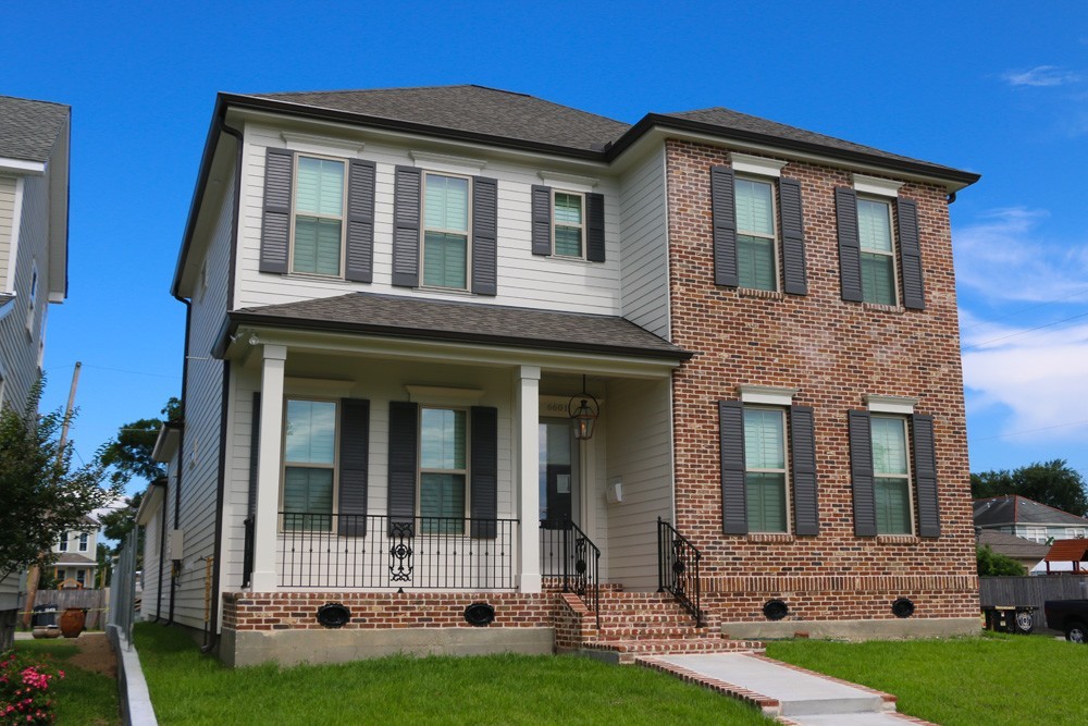 Shutters on red brick Metairie home - Strong Shield