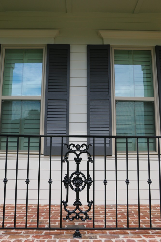 Shutters on white hardie siding in New Orleans - Strong Shield