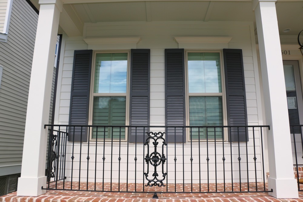 Light navy shutters on white siding - Strong Shield