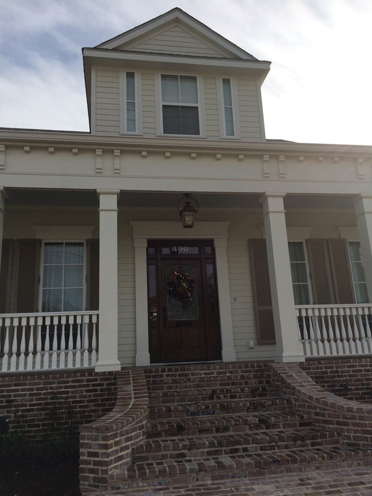 Craftsman style columns and door trim on New Orleans home - Strong Shield