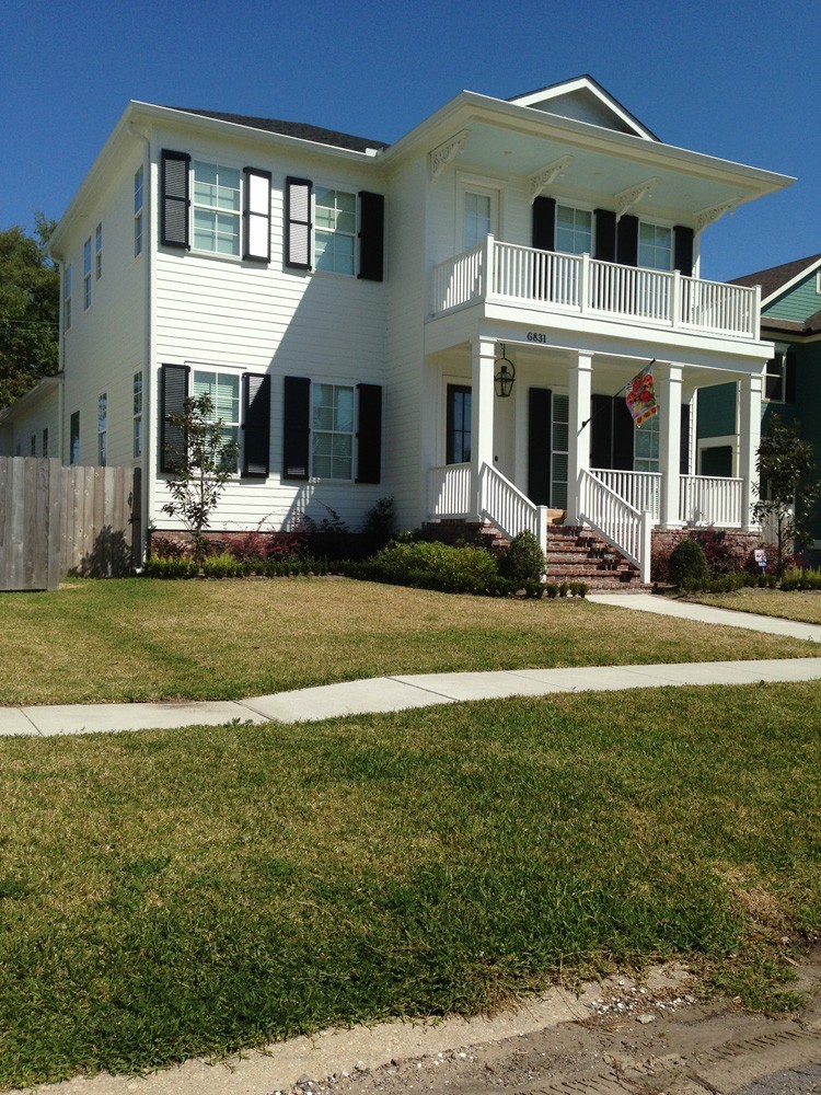 Louvered style shutters on two story home in Metairie - Strong Shield