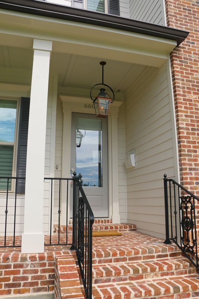 Iron railing and craftsman columns - Strong Shield