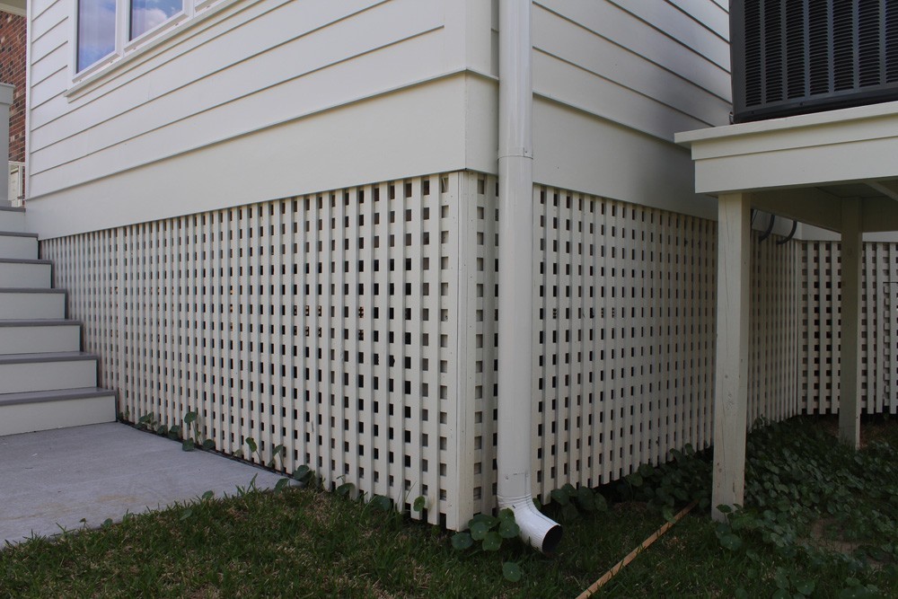 Raised home crawl space skirting and gutter downspout - Strong Shield