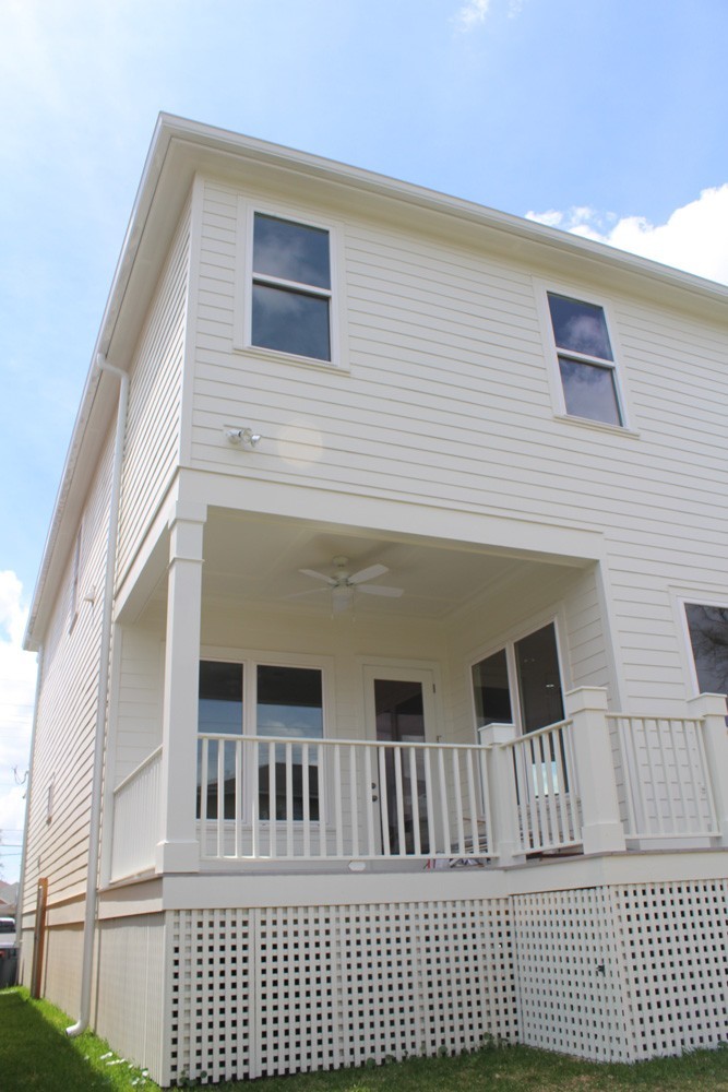 Craftsman style trim and accents on raised New Orleans home - Strong Shield