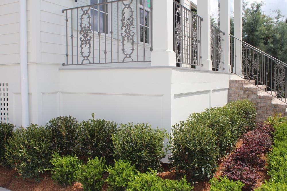 Craftsman style front porch on raised home - Strong Shield